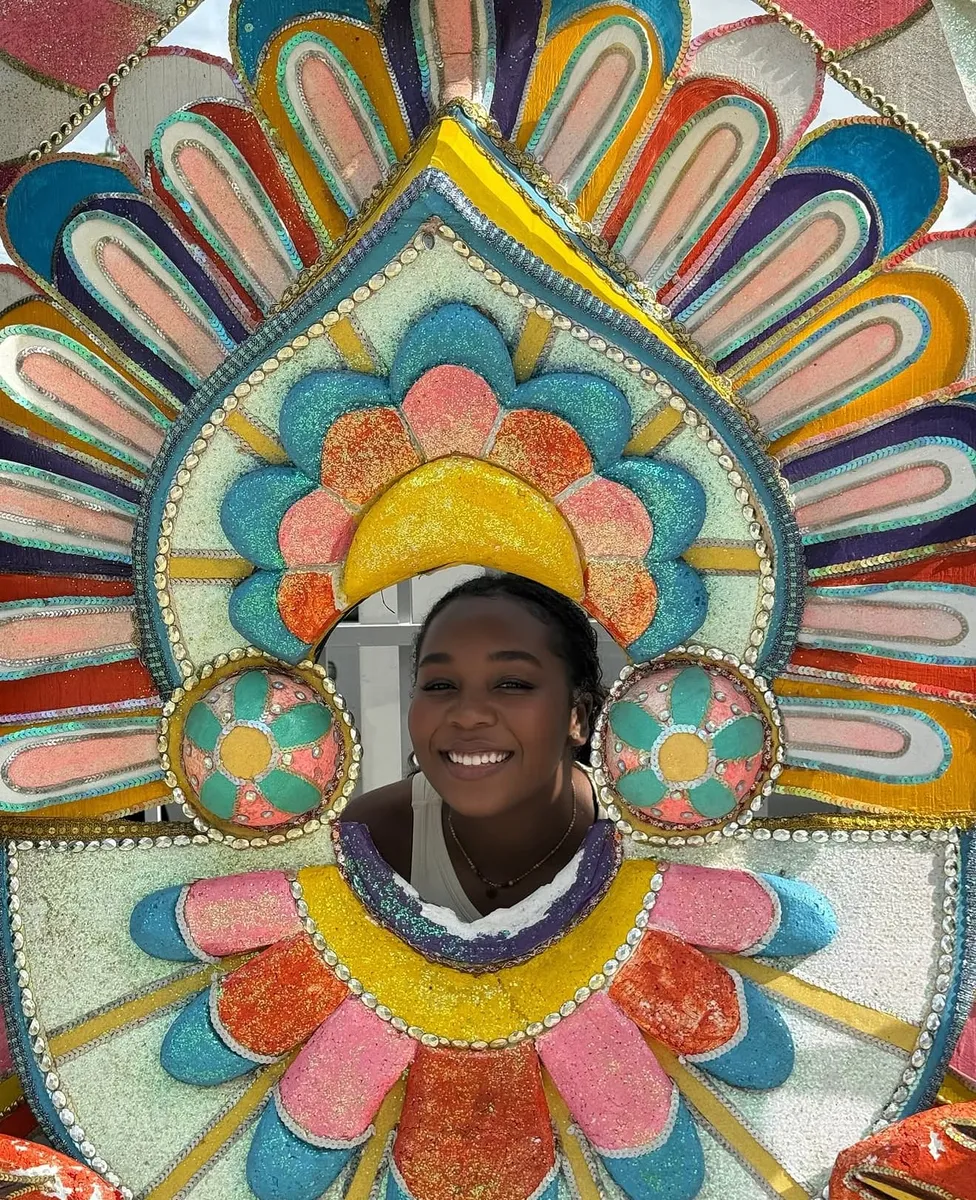 Kariel in a Junkanoo costume headpiece